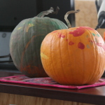 Preschool story time children painted pumpkins.